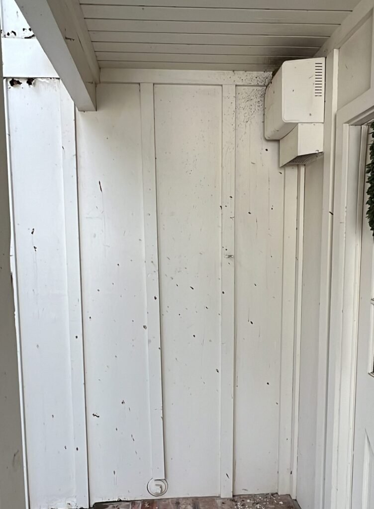 Clean white siding and eaves after a soft wash house washing